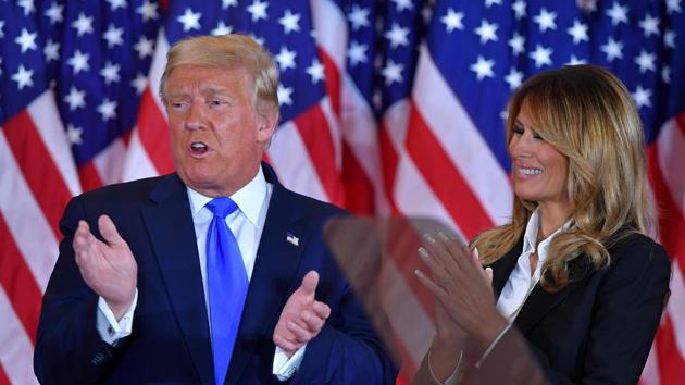 US President Donald Trump claps alongside US First Lady Melania Trump after speaking during election night in the East Room of the White House in Washington, DC. (AFP) US President Donald Trump claps alongside US First Lady Melania Trump after speaking during election night in the East Room of the White House in Washington, DC. (AFP)