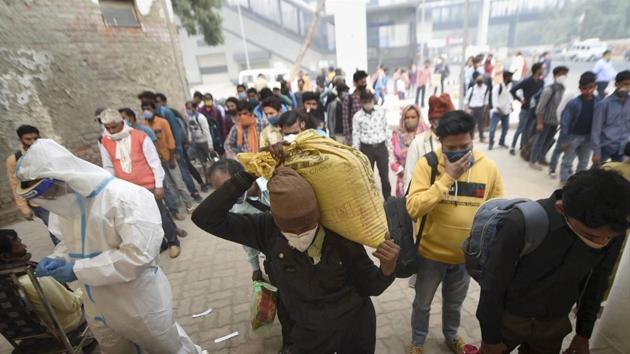 Passengers wait to undergo COVID-19 RAT test at Anand Vihar Bus Terminal, as coronavirus cases surge across Delhi.(PTI)