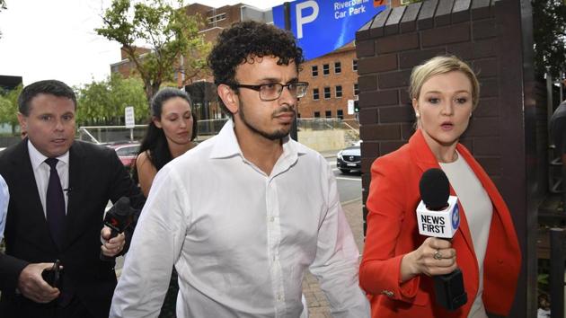 Arsalan Tariq Khawaja, center, is seen at Parramatta Police Station in Sydney, Tuesday, Dec. 4, 2018.(AP) Arsalan Tariq Khawaja, center, is seen at Parramatta Police Station in Sydney, Tuesday, Dec. 4, 2018.(AP)