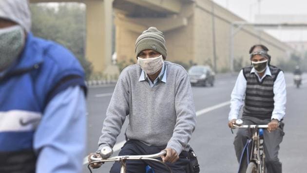 Cyclists out on a hazy and cold morning at Rao Tula Ram Marg in New Delhi on November 4. According to the IMD, Delhi has been experiencing cold wave like conditions because of cold north-westerly winds from the Himalayas blowing over the northern plains and subsidence of cold air over parts of the north-western region. (Sanjeev Verma / HT Photo) Cyclists out on a hazy and cold morning at Rao Tula Ram Marg in New Delhi on November 4. According to the IMD, Delhi has been experiencing cold wave like conditions because of cold north-westerly winds from the Himalayas blowing over the northern plains and subsidence of cold air over parts of the north-western region. (Sanjeev Verma / HT Photo)
