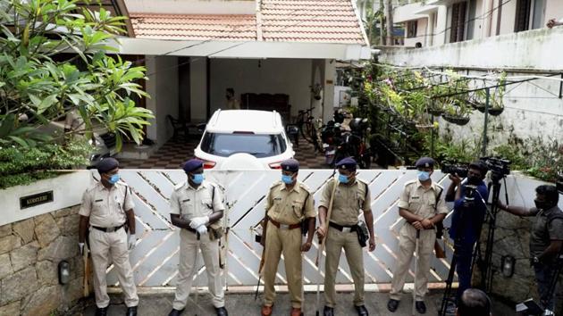 Security personnel stand guard outside the Thiruvananthapuram residence of Bineesh Kodiyeri, son of Kerala CPI (M) secretary Kodiyeri Balakrishnan, during a 26-hour raid that ended Thursday morning(PTI)