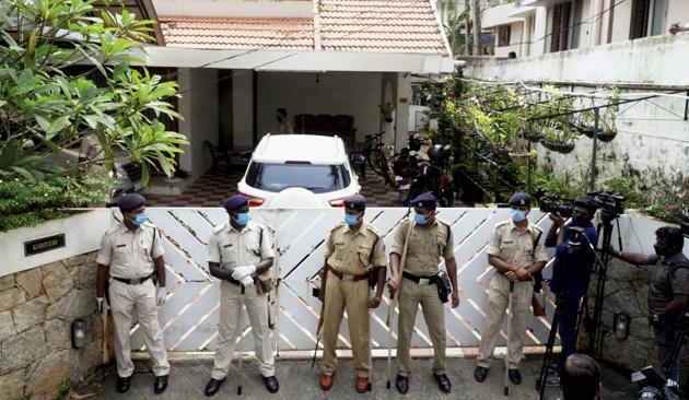 Security personnel stand guard outside the residence of Bineesh Kodiyeri on Wednesday.(PTI)