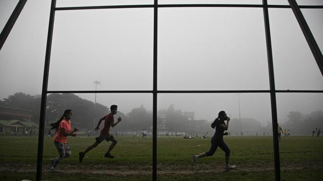 Joggers on a foggy morning in Guhwati on November 2. Health ministry data shows that 16 states and union territories have cases per million lower than national average. The national average of cases per million is 6,025. (Anupam Nath / AP) Joggers on a foggy morning in Guhwati on November 2. Health ministry data shows that 16 states and union territories have cases per million lower than national average. The national average of cases per million is 6,025. (Anupam Nath / AP)