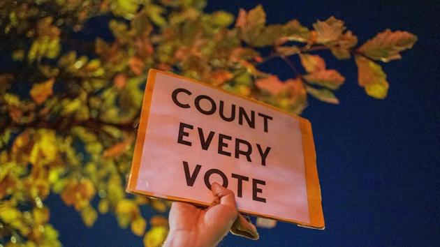 A protester is holding a Count Every Vote sign during protesting against racism in Minneapolis, Minnesota on November 4. (AFP) A protester is holding a Count Every Vote sign during protesting against racism in Minneapolis, Minnesota on November 4. (AFP)