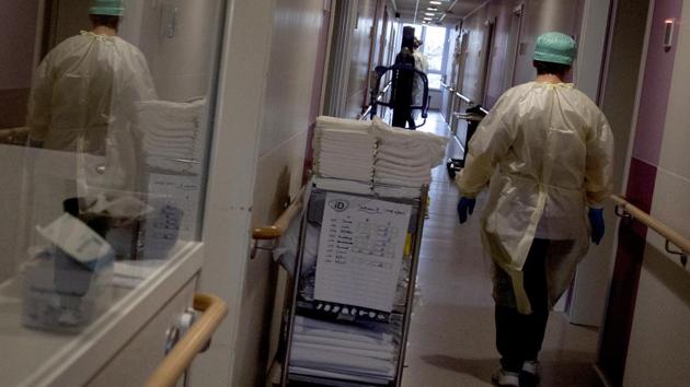 A healthcare supervisor walks down the hallway as she does her rounds in the Covid-19 ward of the CHC nursing home in Landenne, Belgium, Wednesday, Nov. 4, 2020. (AP photo) A healthcare supervisor walks down the hallway as she does her rounds in the Covid-19 ward of the CHC nursing home in Landenne, Belgium, Wednesday, Nov. 4, 2020. (AP photo)