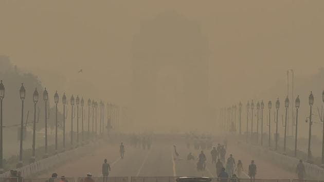 A blanket of haze covers the India Gate as morning walkers are also seen on the Rajpath, in New Delhi. (File photo) A blanket of haze covers the India Gate as morning walkers are also seen on the Rajpath, in New Delhi. (File photo)