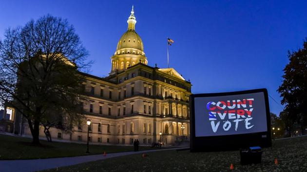 Following attempts by the Trump campaign to stop the vote count in Michigan, local civic groups projected “Count Every Vote” on a giant screen in front of the Michigan State Capitol on November 5 in Lansing. The big shift to postal ballots this year has reflected the desire of voters to avoid risking exposure to Covid-19 in crowded polling stations during a pandemic that has already killed 235,000 Americans. (Kevin Fowler / AP Images for AVAAZ) Following attempts by the Trump campaign to stop the vote count in Michigan, local civic groups projected “Count Every Vote” on a giant screen in front of the Michigan State Capitol on November 5 in Lansing. The big shift to postal ballots this year has reflected the desire of voters to avoid risking exposure to Covid-19 in crowded polling stations during a pandemic that has already killed 235,000 Americans. (Kevin Fowler / AP Images for AVAAZ)