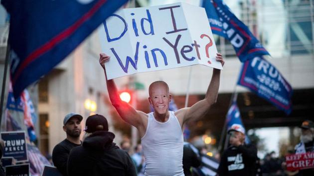A Trump supporter wearing Joe Biden mask protests outside of the Philadelphia Convention Centre, in Pennsylvania on November 5. Backers of President Donald Trump ramped up demonstrations on November 5 against an election they believe was rigged or being stolen, as vote counting continued in battleground states. (Mark Makela / REUTERS)