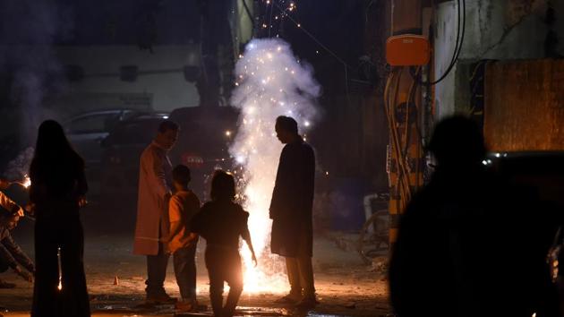 A file photo of people bursting crackers is relevant even two years later. Delhi remains engulfed in a haze as pollution levels increase.(PHOTO: Amal KS/HT)