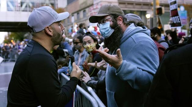Protesters exchange points of view outside the Pennsylvania Convention Centre while votes are counted inside on November 5. Mail-in ballots have tilted heavily to Democrats this year. In the crucial state of Pennsylvania, the Trump campaign moved to stop the counting of ballots, which authorities were forbidden from processing before Election Day. (Matt Slocum / AP) Protesters exchange points of view outside the Pennsylvania Convention Centre while votes are counted inside on November 5. Mail-in ballots have tilted heavily to Democrats this year. In the crucial state of Pennsylvania, the Trump campaign moved to stop the counting of ballots, which authorities were forbidden from processing before Election Day. (Matt Slocum / AP)