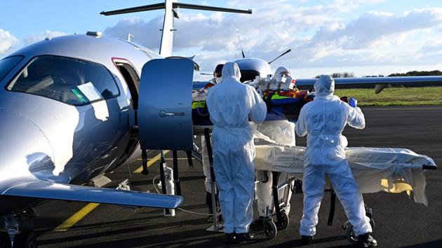 Medical staff take custody of a Covid-19 patient being transferred by plane from Saint-Etienne at Angers airport in France during the nationwide lockdown on November 4. Even though France locked down last week, there is little respite from rapidly spreading infections. 58,046 fresh Covid-19 cases were added to France’s coronavirus tally on November 5. (Damien Meyer / AFP) Medical staff take custody of a Covid-19 patient being transferred by plane from Saint-Etienne at Angers airport in France during the nationwide lockdown on November 4. Even though France locked down last week, there is little respite from rapidly spreading infections. 58,046 fresh Covid-19 cases were added to France’s coronavirus tally on November 5. (Damien Meyer / AFP)