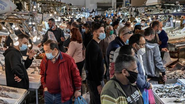 People shop at the central market in Athens on November 5 after a second lockdown was approved for the country. Greece is the latest European country to announce plans to re-enter lockdown from November 7 for a period of three weeks to battle a second wave of the coronavirus infections. Greek Prime Minister Kyriakos Mitsotakis attributed the step to a sharp rise of 15,559 Covid-19 cases within merely 12 days. (Aby Gouliamaki / AFP) People shop at the central market in Athens on November 5 after a second lockdown was approved for the country. Greece is the latest European country to announce plans to re-enter lockdown from November 7 for a period of three weeks to battle a second wave of the coronavirus infections. Greek Prime Minister Kyriakos Mitsotakis attributed the step to a sharp rise of 15,559 Covid-19 cases within merely 12 days. (Aby Gouliamaki / AFP)