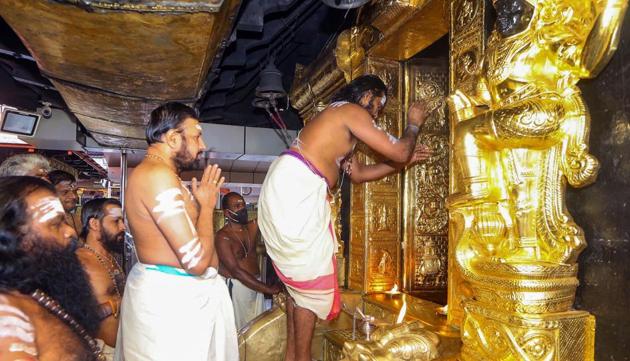 Priests perform rituals for the 'Tulamas Puja' at the Sabarimala temple, in Pathanamthitta district.(PTI)