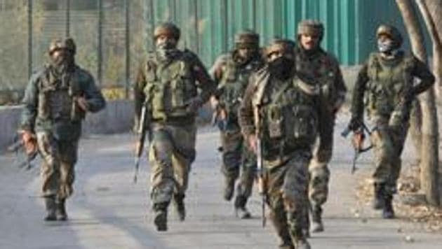 Army soldiers seen near the site of an encounter at Lalpora area of Pampore in south Kashmir's Pulwama district, on Friday, Nov 06, 2020.(Waseem Andrabi/ Hindustan Times) Army soldiers seen near the site of an encounter at Lalpora area of Pampore in south Kashmir's Pulwama district, on Friday, Nov 06, 2020.(Waseem Andrabi/ Hindustan Times)