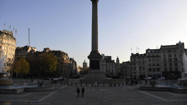 An empty Trafalgar Square in central London on November 5. Britain joined large swathes of Europe in a coronavirus lockdown designed to save its health care system from being overwhelmed. Pubs, along with restaurants, hairdressers and shops selling non-essential items closed on Thursday until at least December. 2. (Alberto Pezzali / AP)