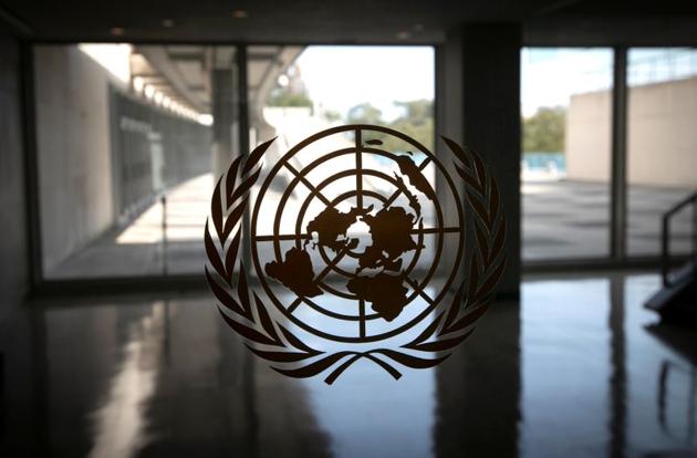 The United Nations logo is seen on a window in an empty hallway at United Nations headquarters during the 75th annual U.N. General Assembly high-level debate in September 2020.(REUTERS)