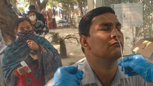 Noida: A medic takes a nasal sample from a man for COVID-19 test, at a district hospital in Noida, Saturday, Nov. 7, 2020.(PTI) Noida: A medic takes a nasal sample from a man for COVID-19 test, at a district hospital in Noida, Saturday, Nov. 7, 2020.(PTI)