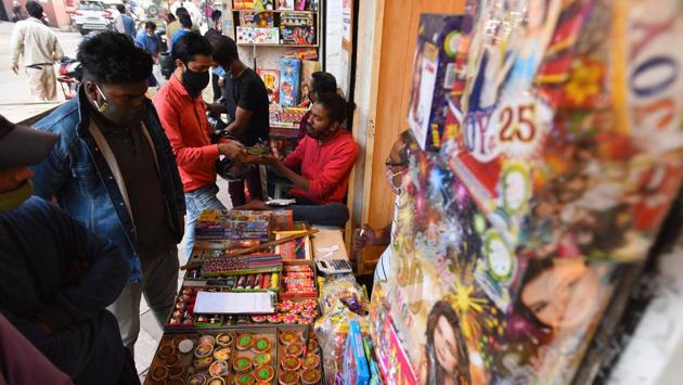 Customers shop for green crackers at a shop in New Delhi on November 5. Chief minister Arvind Kejriwal had on November 5 also announced a blanket ban on the sale and use of fireworks, including those of the “green varieties,” in the capital till November 30, in a bid to check Delhi’s rising pollution levels. Penalties up to ₹1 lakh have been announced for violators. (Raj K Raj / HT Photo) Customers shop for green crackers at a shop in New Delhi on November 5. Chief minister Arvind Kejriwal had on November 5 also announced a blanket ban on the sale and use of fireworks, including those of the “green varieties,” in the capital till November 30, in a bid to check Delhi’s rising pollution levels. Penalties up to ₹1 lakh have been announced for violators. (Raj K Raj / HT Photo)