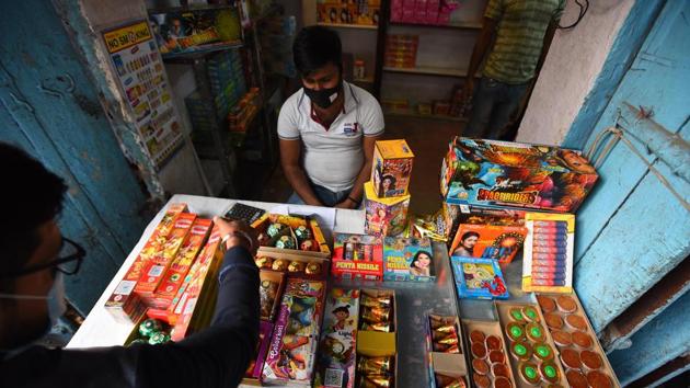 A customer looks to buy green crackers ahead of Diwali festival, at Dariba Kalan in New Delhi on Thursday, November 5, 2020. (Raj K Raj/HT PHOTO) A customer looks to buy green crackers ahead of Diwali festival, at Dariba Kalan in New Delhi on Thursday, November 5, 2020. (Raj K Raj/HT PHOTO)