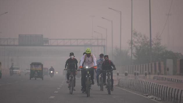 Cyclists ride along NH24 on a smoggy day in New Delhi on November 7. According to the Ministry of Earth Sciences’ air quality monitor, SAFAR, Delhi’s overall AQI was 443 in the morning on November 7. No quick recovery is expected unless a drastic reduction in fire counts takes place, SAFAR said in its daily bulletin. (Raj K Raj / HT Photo) Cyclists ride along NH24 on a smoggy day in New Delhi on November 7. According to the Ministry of Earth Sciences’ air quality monitor, SAFAR, Delhi’s overall AQI was 443 in the morning on November 7. No quick recovery is expected unless a drastic reduction in fire counts takes place, SAFAR said in its daily bulletin. (Raj K Raj / HT Photo)