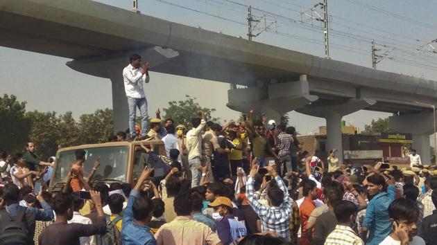 People block Agra National Highway road as they stage a protest demanding justice for Nikita, who was shot dead in Ballabhgarh a few days ago, at Ballabhgarh in Faridabad district, Sunday, Nov. 1, 2020.(PTI)