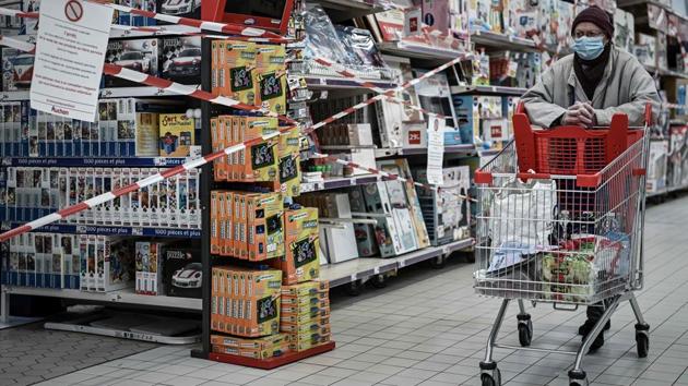 A customer pushes a trolley past the closed toy department of a supermarket in Bordeaux on November 4. The new lockdown has also meant forcing closure upon non-essential shops, including cafes, restaurants and shops not selling basic foods or medicines. (Philippe Lopez / AFP)
