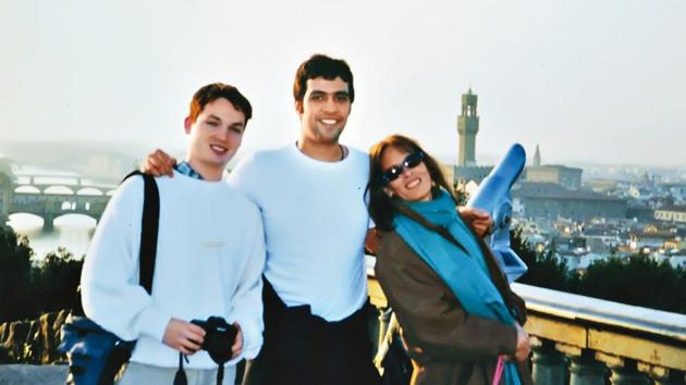 Aatish with his friends in Florence with the river Arno and its bridges behind him