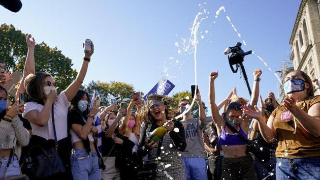 Amanda Madden sprays champagne as people celebrate at Black Lives Matter Plaza after CNN called the race in favour of Democratic presidential candidate Joe Biden, in Washington on November 7. Biden’s victory came after more than days of uncertainty as election officials sorted through a surge of mail-in votes that delayed the processing of some ballots. (Alex Brandon / AP) Amanda Madden sprays champagne as people celebrate at Black Lives Matter Plaza after CNN called the race in favour of Democratic presidential candidate Joe Biden, in Washington on November 7. Biden’s victory came after more than days of uncertainty as election officials sorted through a surge of mail-in votes that delayed the processing of some ballots. (Alex Brandon / AP)