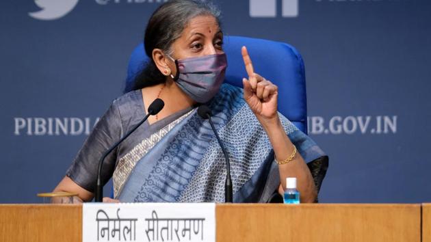 Nirmala Sitharaman, India's finance minister, wears a protective mask while speaking during a news conference in New Delhi. Due to the Covid-19 pandemic and subsequent 68-day lockdown since March 25, GST collections fell sharply in April and continued to contract till August.(Bloomberg)