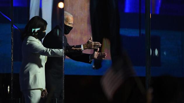 US President-elect Joe Biden and Vice President-elect Kamala Harris greet guests during an election event in Wilmington, Delaware.(Bloomberg) US President-elect Joe Biden and Vice President-elect Kamala Harris greet guests during an election event in Wilmington, Delaware.(Bloomberg)