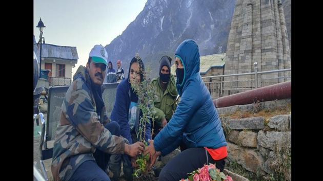 Himalayan Balsam sapling being planted in front of the temple.(ANI)