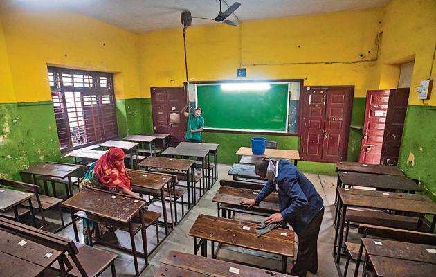 Workers clean classrooms at Katariya school, Gultekdi in Pune, India, on Monday.(Pratham Gokhale/HT Photo)