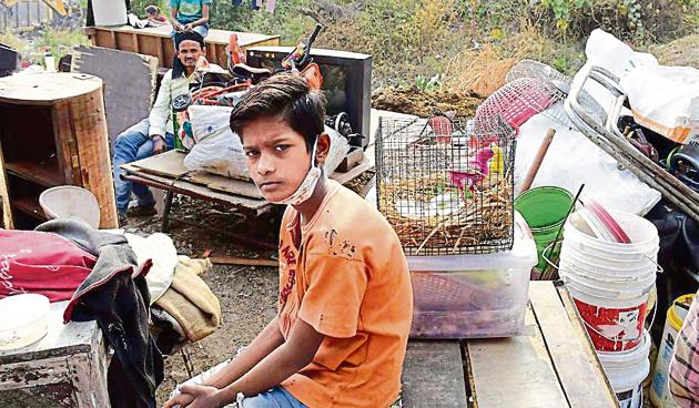 Area residents collecting their belongings after the demolition drive by Ludhiana Improvement Trust at Model Town Extension Part 1, in Ludhiana on Monday.(Gurpreet Singh//HT)