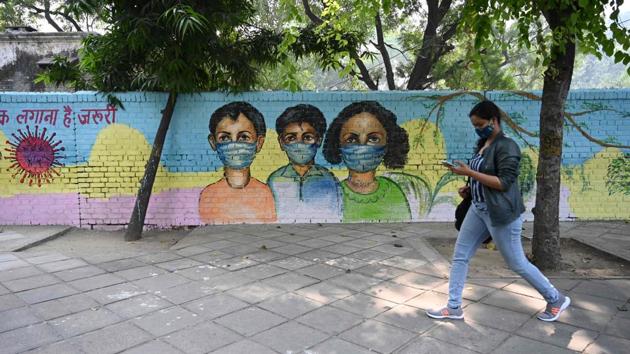 A woman walks past a mural on Covid-19 awareness in New Delhi on November 7. On November 8, Delhi recorded its biggest ever single day jump of 7,745 Covid-19 cases and 77 deaths which pushed the tally and death toll to 438,529 and 6,989 respectively, HT reported. (Sajjad Hussain / AFP) A woman walks past a mural on Covid-19 awareness in New Delhi on November 7. On November 8, Delhi recorded its biggest ever single day jump of 7,745 Covid-19 cases and 77 deaths which pushed the tally and death toll to 438,529 and 6,989 respectively, HT reported. (Sajjad Hussain / AFP)