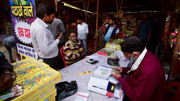 Customers buy firecrackers ahead of Diwali in Allahabad on November 9. However, in cities or towns where the air quality is “moderate” or below, only green fire crackers will be sold and the time duration for bursting them will be restricted to two hours on the day of the festivities. (Sanjay Kanojia / AFP) Customers buy firecrackers ahead of Diwali in Allahabad on November 9. However, in cities or towns where the air quality is “moderate” or below, only green fire crackers will be sold and the time duration for bursting them will be restricted to two hours on the day of the festivities. (Sanjay Kanojia / AFP)