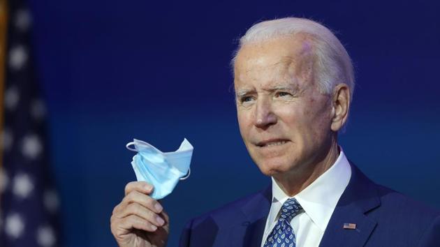 US President-elect Joe Biden holds a protective mask as he speaks to the media after receiving a briefing from the transition Covid-19 advisory board on November 9. (AFP) US President-elect Joe Biden holds a protective mask as he speaks to the media after receiving a briefing from the transition Covid-19 advisory board on November 9. (AFP)