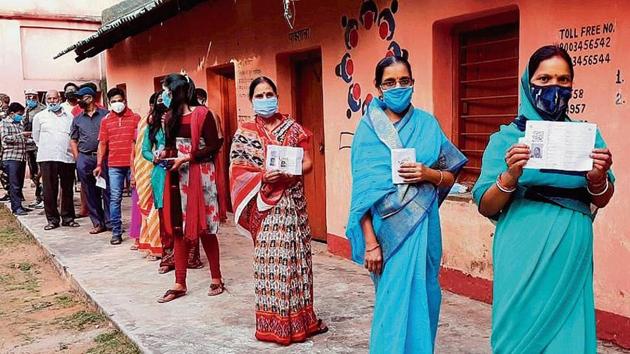 Women show their fingers marked with indelible ink after casting vote during the Jharkhand Assembly bypolls, amid the ongoing coronavirus pandemic, in Dumka district, Tuesday, Nov. 3, 2020. (PTI Photo)