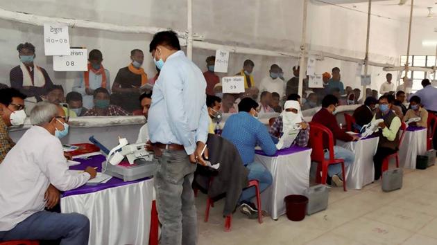 Counting of votes in progress for the Bihar Assembly election results, at a counting centre in Chhapra on Tuesday. (PTI Photo) Counting of votes in progress for the Bihar Assembly election results, at a counting centre in Chhapra on Tuesday. (PTI Photo)
