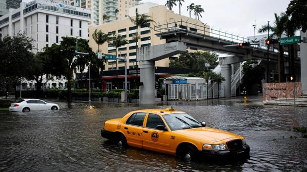 A damaged taxi is seen in floodwaters caused by Tropical Storm Eta in a street in Miami, Florida on November 9. A deluge of rain from Tropical Storm Eta caused flooding across South Florida’s most densely populated urban areas on November 9, stranding cars, flooding businesses, and swamping entire neighbourhoods with fast-rising water that had no place to drain. (Marco Bello / REUTERS)