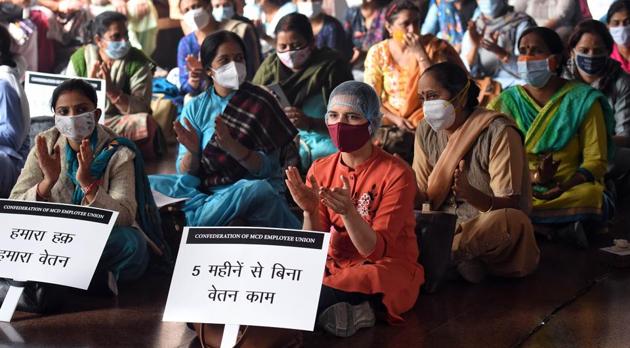MCD doctors and other staff during a protest at Civic center, in New Delhi . (ANI)