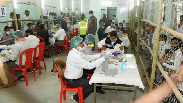 Election officials counting votes at a polling centre in Patna on November 10. Through the day the BJP appeared set to leave its ally JD (U) far behind in the seat tally, emerging as the senior partner in the alliance for the first time in about two decades. (Santosh Kumar / HT Photo) 