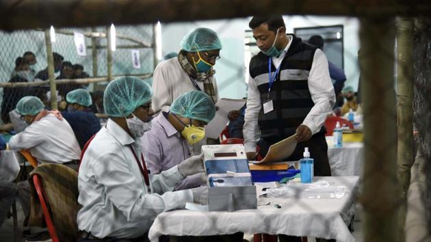 Election officers at a counting centre in Patna on Tuesday. (AP) Election officers at a counting centre in Patna on Tuesday. (AP)