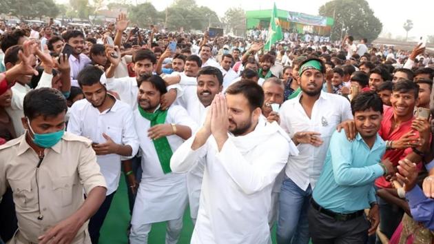 RJD leader Tejashwi Yadav gestures towards the crowd during an election rally ahead of the third phase of Bihar Assembly elections, in Mahua, Bihar. (Photo by Santosh Kumar/ Hindustan Times)