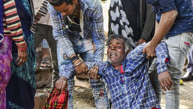Family members grieve after four children died due to soil subsidence near a nullah at Berkhedi village, in Bhopal district on Monday. (PTI) Family members grieve after four children died due to soil subsidence near a nullah at Berkhedi village, in Bhopal district on Monday. (PTI)