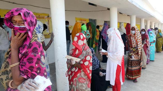 Voters stand in the queue to cast their votes at a polling booth in Sanchi assembly constituency during by-elections at Salamatpur, Raisen district in Bhopal on November 3. (ANI Photo) (ANI) Voters stand in the queue to cast their votes at a polling booth in Sanchi assembly constituency during by-elections at Salamatpur, Raisen district in Bhopal on November 3. (ANI Photo) (ANI)