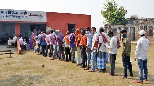 Bihar Election Results 2020: Voters standing in the queue to cast their votes, at a polling booth, during the 2nd phase of the Bihar Assembly Election, in Saran. (ANI) Bihar Election Results 2020: Voters standing in the queue to cast their votes, at a polling booth, during the 2nd phase of the Bihar Assembly Election, in Saran. (ANI)