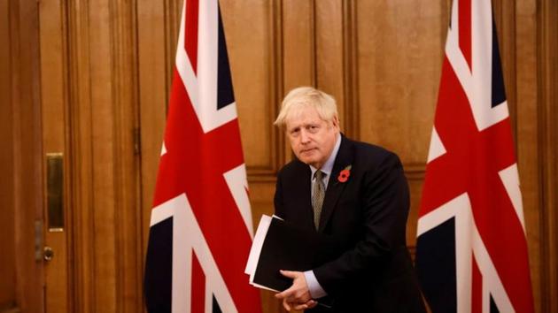 Britain's Prime Minister Boris Johnson leaves at the end of a virtual news conference on the coronavirus disease pandemic in the UK inside 10 Downing Street in central London. (REUTERS) Britain's Prime Minister Boris Johnson leaves at the end of a virtual news conference on the coronavirus disease pandemic in the UK inside 10 Downing Street in central London. (REUTERS)