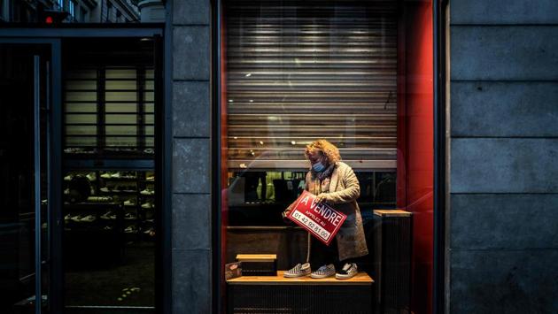 A shop owner installs a public display board at her shop reading “For Sale” in Lyon, France on November 10. Governments across Europe have been forced to impose control measures including local curfews, closing non-essential shops and restricting movement in a region already facing a wave of job losses and business failures. (Jeff Pachoud / AFP) A shop owner installs a public display board at her shop reading “For Sale” in Lyon, France on November 10. Governments across Europe have been forced to impose control measures including local curfews, closing non-essential shops and restricting movement in a region already facing a wave of job losses and business failures. (Jeff Pachoud / AFP)