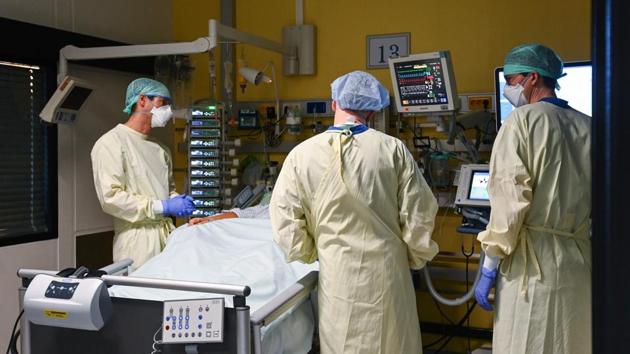 Doctors tend to a patient in the intensive care unit (ICU) of the University Hospital in Aachen, Germany on November 10. With just 10 per cent of the world’s population, Europe accounts for almost a quarter of the 1.2 million deaths globally, and even its well-equipped hospitals are feeling the strain. (Ina Fassbender / AFP) Doctors tend to a patient in the intensive care unit (ICU) of the University Hospital in Aachen, Germany on November 10. With just 10 per cent of the world’s population, Europe accounts for almost a quarter of the 1.2 million deaths globally, and even its well-equipped hospitals are feeling the strain. (Ina Fassbender / AFP)