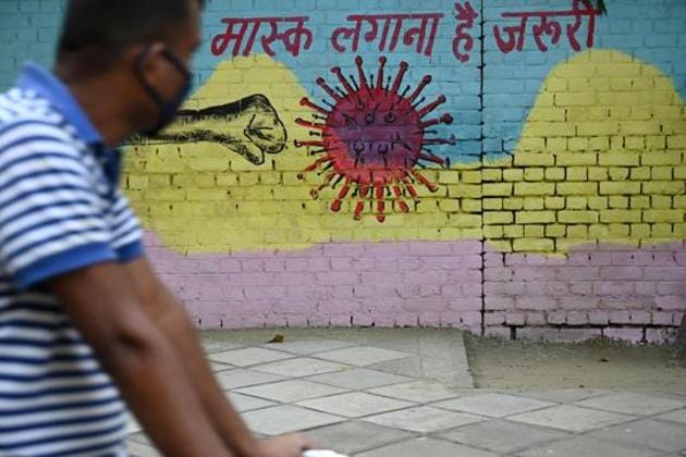 AIIMS director Dr Randeep Guleria said there is an acute need for everyone to wear masks whenever they are in places with a considerable number of people (AFP) AIIMS director Dr Randeep Guleria said there is an acute need for everyone to wear masks whenever they are in places with a considerable number of people (AFP)